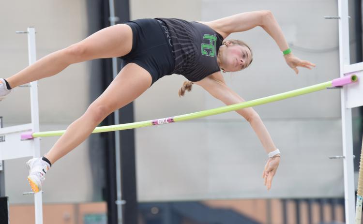 Macy Moore qualfied with a new school record in pole vault.