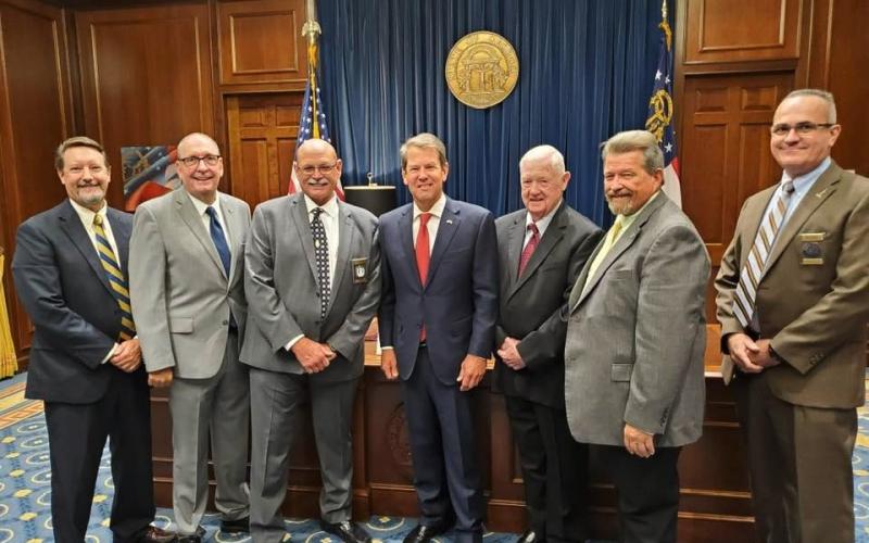 Lavonia Police Chief Bruce Carlisle was recently sworn in as the Georgia Association of Chiefs of Police (GACP) representative on the Board of Public Safety. Pictured (from left) are Lyons Police Chief and GACP President Wesley Walker, Jefferson Police Chief and GACP Immediate Past President Joseph Wirthman, Carlisle, Gov. Brian Kemp, Lavonia Mayor Ralph Owens, Rep. Alan Powell and Lilburn Police Chief and GACP Vice President Bruce Hedley.