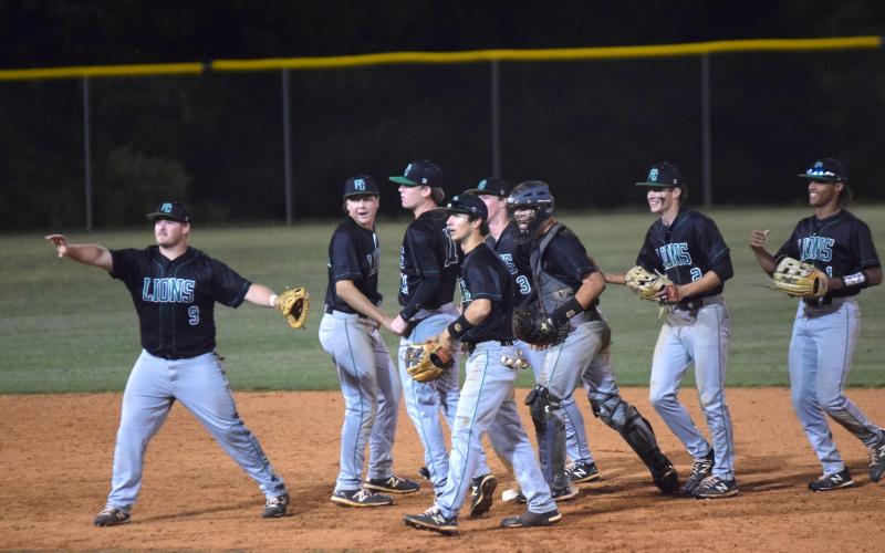 The Franklin County Lions celebrate after defeating Sonoraville Wednesday to advance to the state playoff quarterfinals.