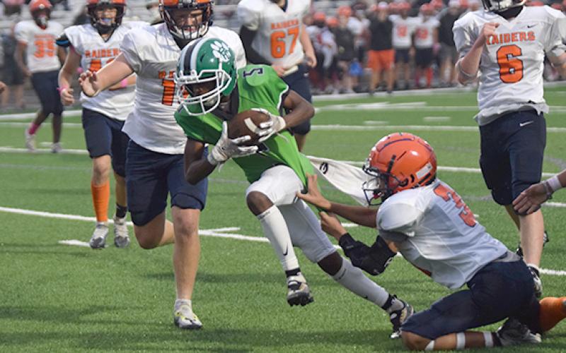 Gavin Wells powers through a would-be tackle on his way to one of his three touchdowns against Habersham County Oct. 12 at Ed Bryant Stadium. (Photo by Scoggins)