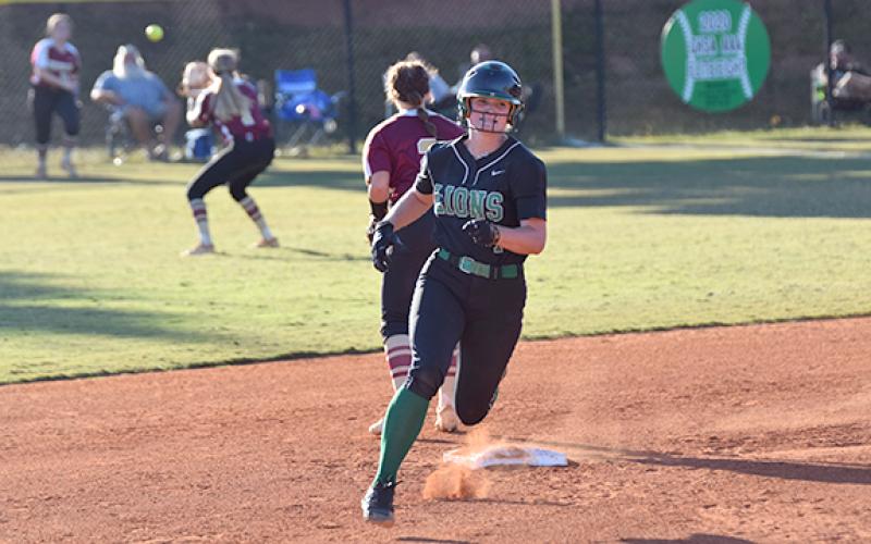 Lady Lion Journey Roberts rounds second on her way to third as Hebron’s outfielders work to get the ball back to the infield. Roberts had two triples, a double and a single in Monday’s victory over Hebron Christian. (Photo by Scoggins)