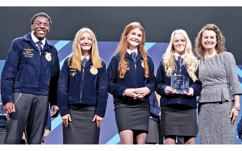 National FFA Vice President Erik Robinson presents the 2022 Middle School Model of Excellence Award to FCMS FFA chapter Secretary Callie Walker, President Darby Roach, Vice President Meghan Langley and Advisor Anna Watkins. (Photos courtesy of FFA)