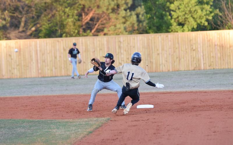 Lion shortstop Dee Oliver prepares to take a throw as a Pendleton, S.C., runner attempts to steal in a game Friday in Carnesville. (Photo by Scoggins)