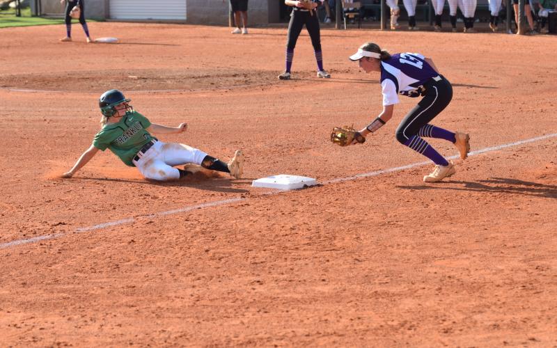 Lady Lion Josie Burton slides safely into third during the Region 8AAA opener against Monroe Area Thursday. (Photos by Scoggins)