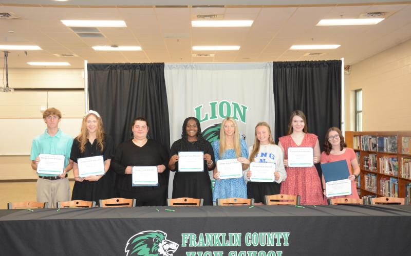 Members of Georgia Future Educators signed certificates Tuesday indicating their intention to teach school in Georgia. Pictured during the signing ceremony in the Franklin County High School media center were (from left) Landon Floyd, Ryleigh Segars, Gwen Noel, Saniya Heard, Savanna Hart, Lealy Day, Helena Burton and Caitlin Buffington. (Photo by Eavenson)