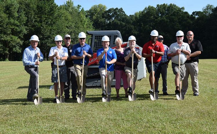Taking part in a groundbreaking ceremony Tuesday for a new amphitheater at the Royston Wellness and Community Park are (from left) City Manager Ed Andrews,  Council Member Wayne Braswell, Street Superintendent Patrick O’Neal, Council Member Matt Fields, Mayor David Jordan, Shirley Rosenberg of the Downtown Development Authority, Council Member Kenneth Roach, Council Member Keith Turman, Water Superintendent Jammie Cawthon, Council Member Lee Strickland and Police Chief Donnie Bolemon. (Photos by Scoggins)