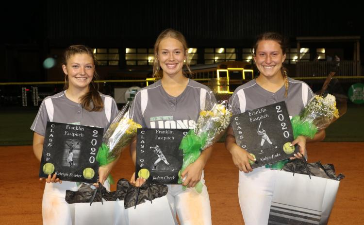 Senior softball players (from left) Kaleigh Fowler, Jaden Cheek and Kalyn Jinks were honored Sept. 18 following Franklin County’s 4-1 win over East Hall. (Photo courtesy of Candace Oliver)