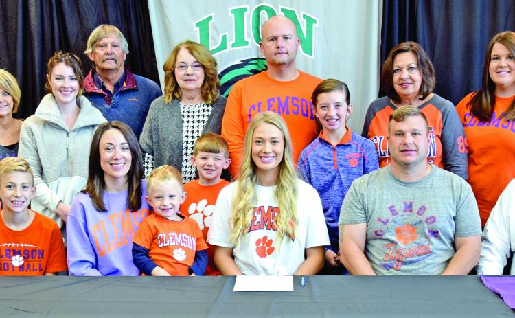 Pictured at Jaden Cheek’s scholarship signing with Clemson University last week are (front, from left) Carson Cheek, Megan Cheek, Cullen Cheek, Jaden Cheek, Jeff Cheek, Joe Cheek, (back) Joey Cheek, Sherri Cheek, Alex McLeroy, Mike Carson, Ellene Carson, Tucker Ruark, Matt Ruark, McKinlee Turner, Terri Cheek and April Ruark. Jaden is also the granddaughter of the late Raynell Cheek.