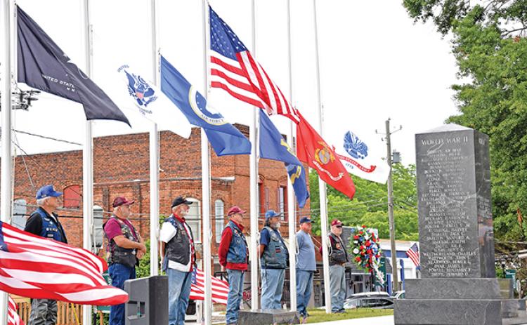 The Memorial Day service was decorated with U.S. flags posted by Richard Roberts of the Patriot Guard Riders, who also participated in the ceremony.