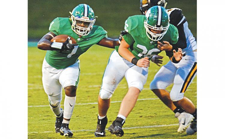Running back Micah Blackwell runs behind the block of D.J. Seymour during Friday’s win over Crescent, S.C., at Ed Bryant Stadium. Blackwell led Franklin with 147 yards rushing on 23 carries. (Photo by Scoggins)