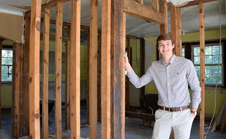 Evan Herring, a 2021 graduate of Franklin County High School, is working to renovate four century-old homes in Lavonia, including the house at 5960 West Avenue. (Photo by Sinclair)