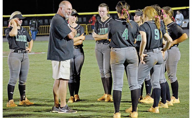 Franklin County Softball Coach Jason Oliver speaks to the eight senior members of his team after the Lady Lions fell in the first round of the state tournament last week to Ringgold in Carnesville. (Photo by Scoggins)
