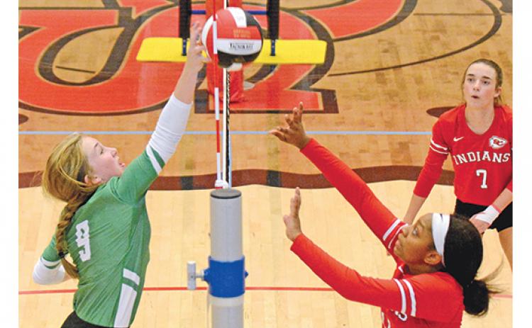 Lady Lion Teague Pierce pokes the ball back over the net in volleyball action against Stephens County last week in the Region 8AAA tournament. (Photo by Scoggins)