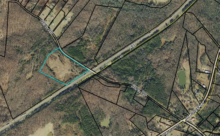 Troy Construction applied to have 15.44 acres at 633 Neal Road rezoned from agriculture intensive to light industrial in order to use the property as storage for the company’s equipment and storage. The property sits along the interstate, but is only accessed by Neal Road.