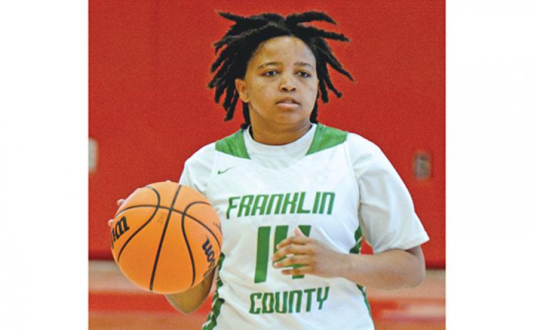 Ny’Kerriah Brown brings the ball up the floor in a game against Winder-Barrow in Jefferson earlier this season. Brown led Franklin County in points in the Lady Lions’ first two wins of the season against Lanier and Seneca, S.C.