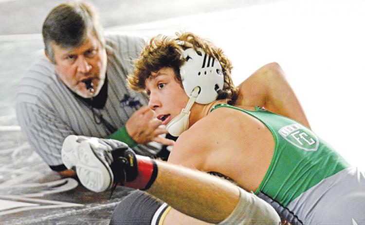 Kenly Eavenson controls an opponent during the Lions Thanksgiving Tournament last week at the wrestling gym on Busha Road in Carnesville. Franklin County will host two home matches in Carnesville next week, their final home matches of the season. (Photo by Scoggins)