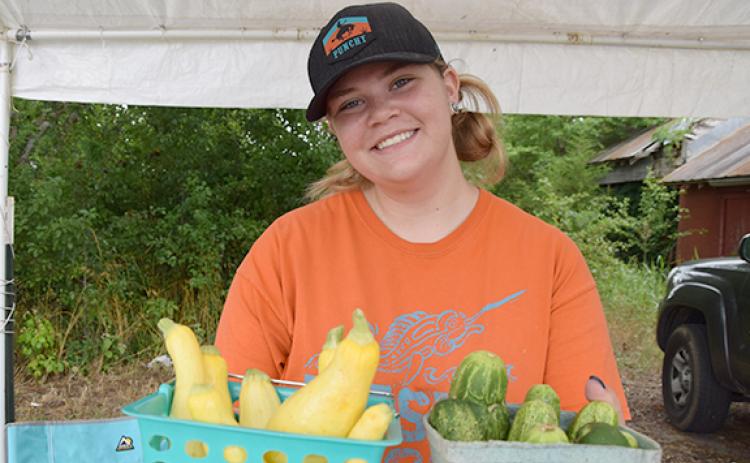 Gracie Minyard offers a variety of fresh produce from her own garden and other local farms at her market locations. (Photo by Sinclair)