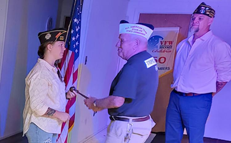 VFW Post 5897 Past Commander Jason Nichols (far right) watches as Commander Gabrielle Beutler is installed Thursday night.