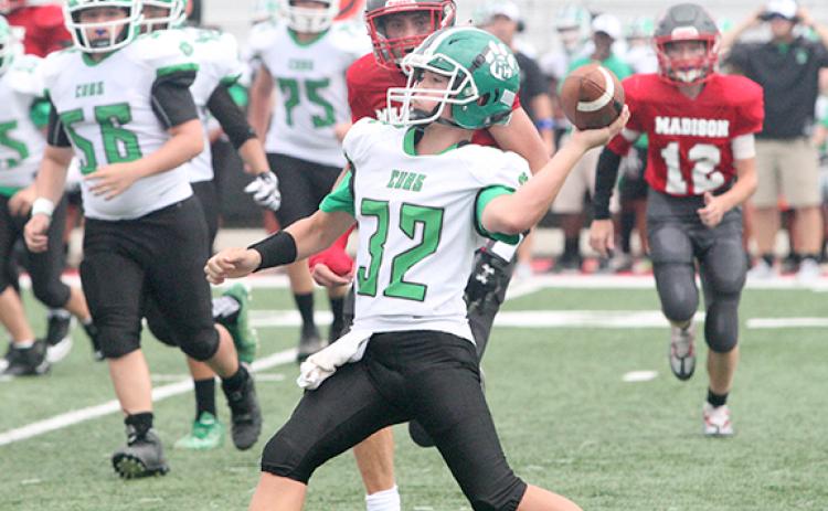 Quarterback Elliott Harbin prepares to throw a pass in FCMS’s victory last week over Madison County in Danielsville. (Photo courtesy of Zach Mitchum at The Madison County Journal)