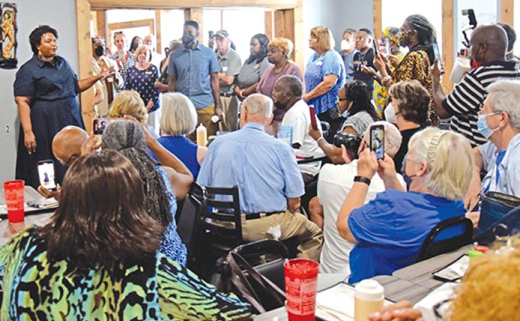 Democratic candidate Stacy Abrams (left) brought her campaign for governor to Royston Thursday, speaking to an overflow crowd at Little Japan Restaurant. (Photo by Scoggins)