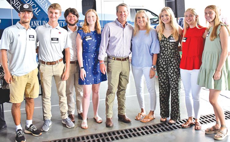 Georgia Gov. Brian Kemp and First Lady Marty Kemp took photos with students who helped with a campaign event Thursday in Franklin Springs. Pictured are (from left) Dee Oliver, Jack Gaines, Grayson Cobb, Hannah Justice, Gov. and First Lady Kemp, Sarah Justice, Rylee Moore and Macy Moore. (Photo by Scoggins)