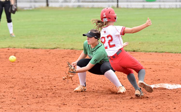 Madison Bryson prepares to catch a throw and apply a tag in action Saturday against Madison County. (Photo by Scoggins)