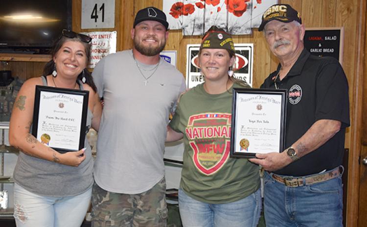 Gabrielle Beutler (second from right) was stripped of her VFW leadership positions after she was arrested last week and charged with false representation as a veteran and other charges. She now faces charges in Franklin and Hart counties as the investigation continues.