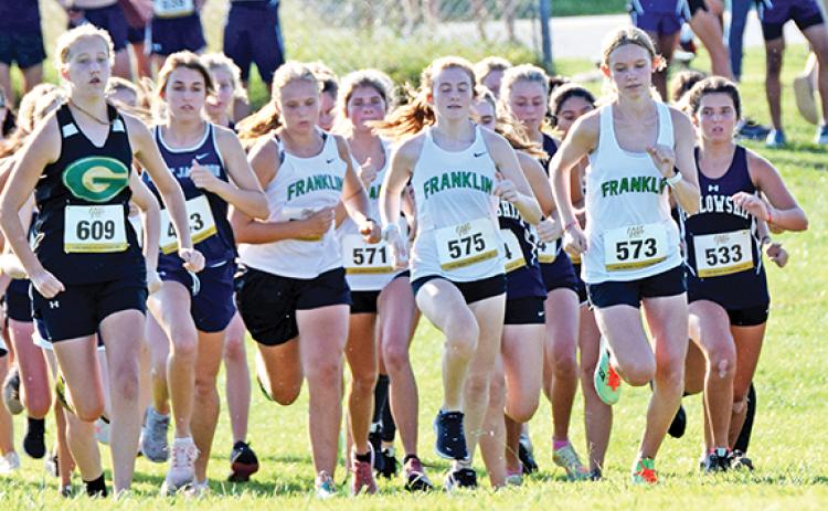 Lady Lions (from left) Kadyn Crowe, Jocelyn Dean (No. 571), Abigail Howie (No. 575) and Megan Hightower (No. 573) take off during the start of the girls’ varsity race at the Jefferson meet. (Photo by Scoggins)