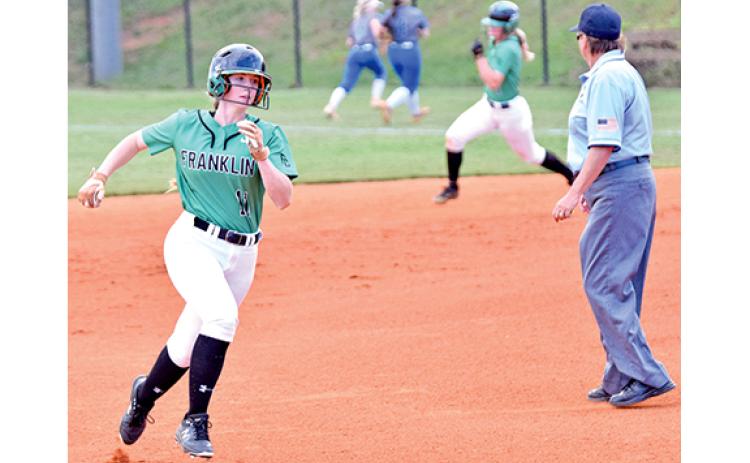 Savanna Lewis (front) and Journey Roberts round the bases after Roberts’ hit against Oconee County Thursday. (Photo by Scoggins)