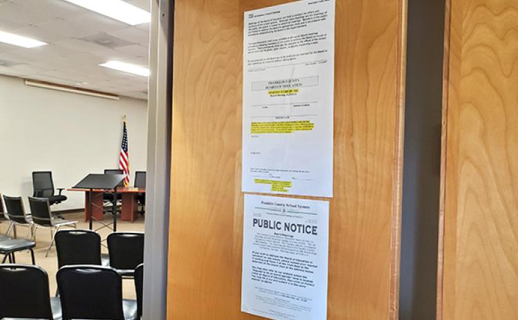 Information about public comment at Franklin County Board of Education meetings is posted on the door of the meeting room in addition to on the board's webpage. (Photo by Sinclair)