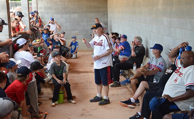 Former Major League Baseball players talk with and answer questions from young players during a previous Major League Baseball Players Alumni Legends for Youth Clinic held at Emmanuel College. The clinic will return to Emmanuel’s baseball field Saturday.