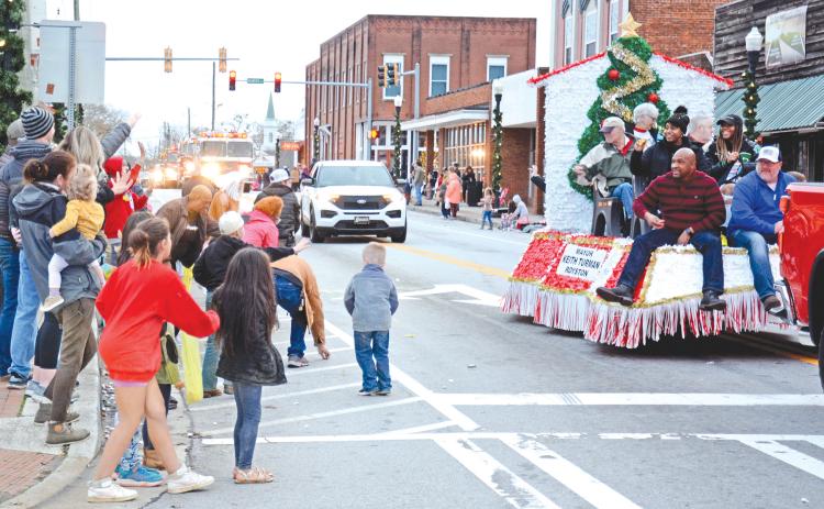 ROYSTON – There were plenty of smiles, waves and candy Saturday evening during the Royston Christmas Parade. Citizens lined the parade route to celebrate the season and watch the parade of emergency vehicles, floats and assorted vehicles. For more photos, see Page 16. (Photos by Scoggins)