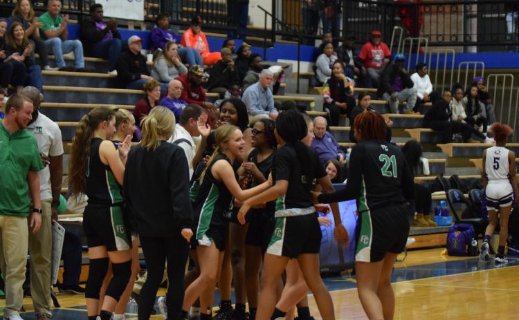 The Franklin County Lady Lions celebrate after defeating Monroe Area Monday in the first round of the Region 8AAA tournament to clinch a state playoff berth. (Photo by Scoggins)