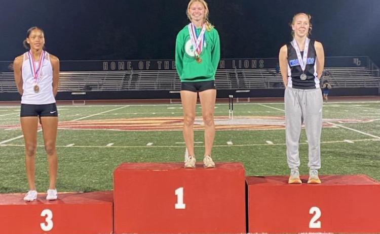 Freshman Megan Hightower (center) won the Region 8AAA championship in the 3,200 meters and will lead 18 other Franklin County athletes to the state sectional meet Saturday in Atlanta.