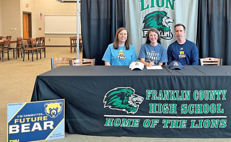 Ashtin Strickland (center), joined by her parents Ashley and Dustin, recently signed a golf scholarship with Truett-McConnell University.