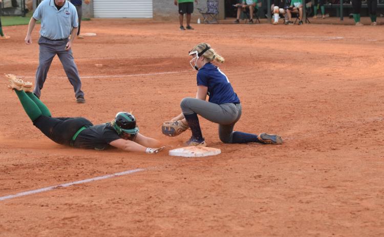 Franklin County’s Karson Johnson beats the tag with a slide into third base Tuesday in the Lady Lions’ home opener against Elbert County. (Photos by Scoggins)