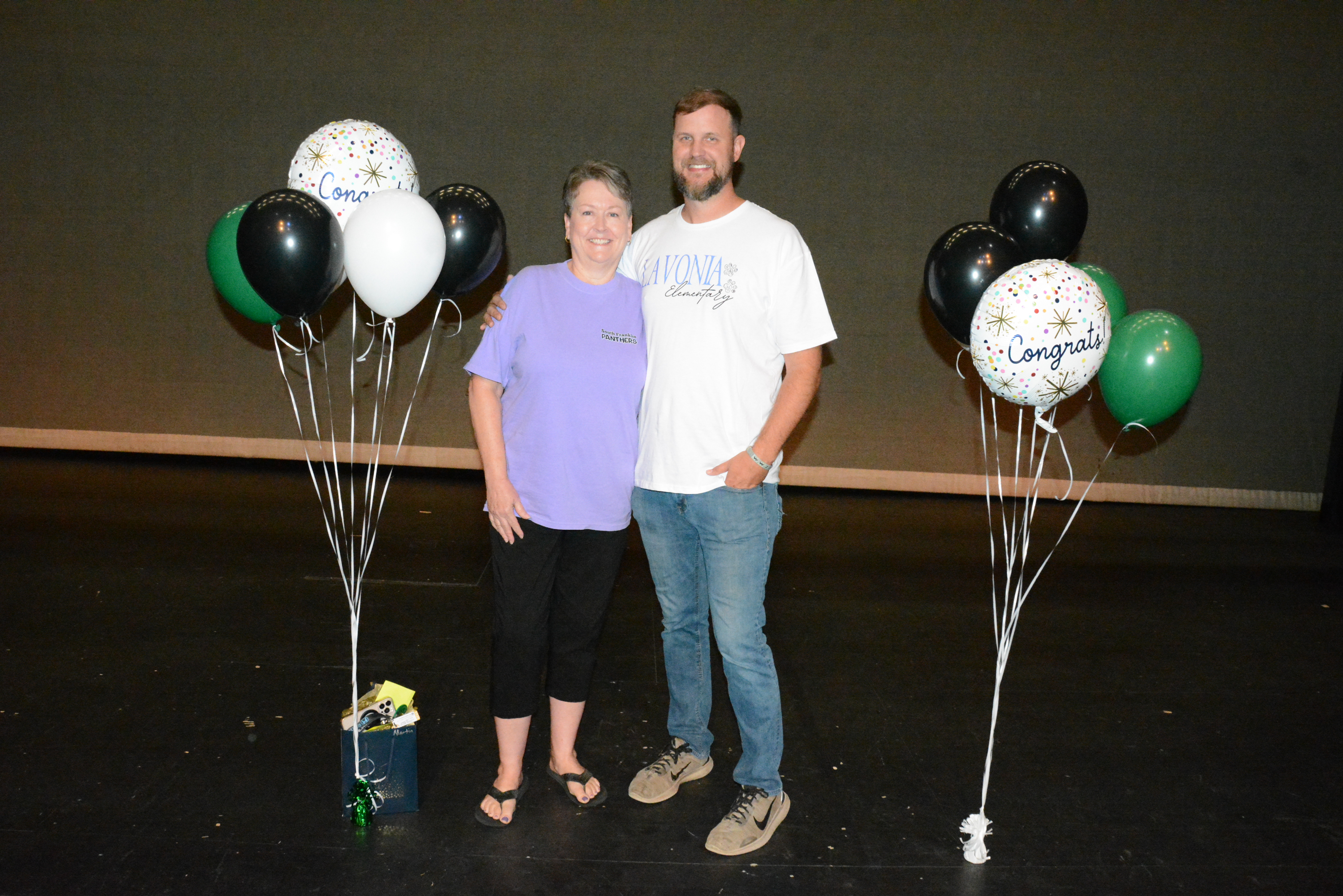 Stephanie Martin (left) and Tyler Matthews (right) were honored as the Franklin County School System’s Support Person of the Year and Teacher of the Year (respectively) during Convocation Monday at Franklin County High School. (Photo by Charlie Eavenson)