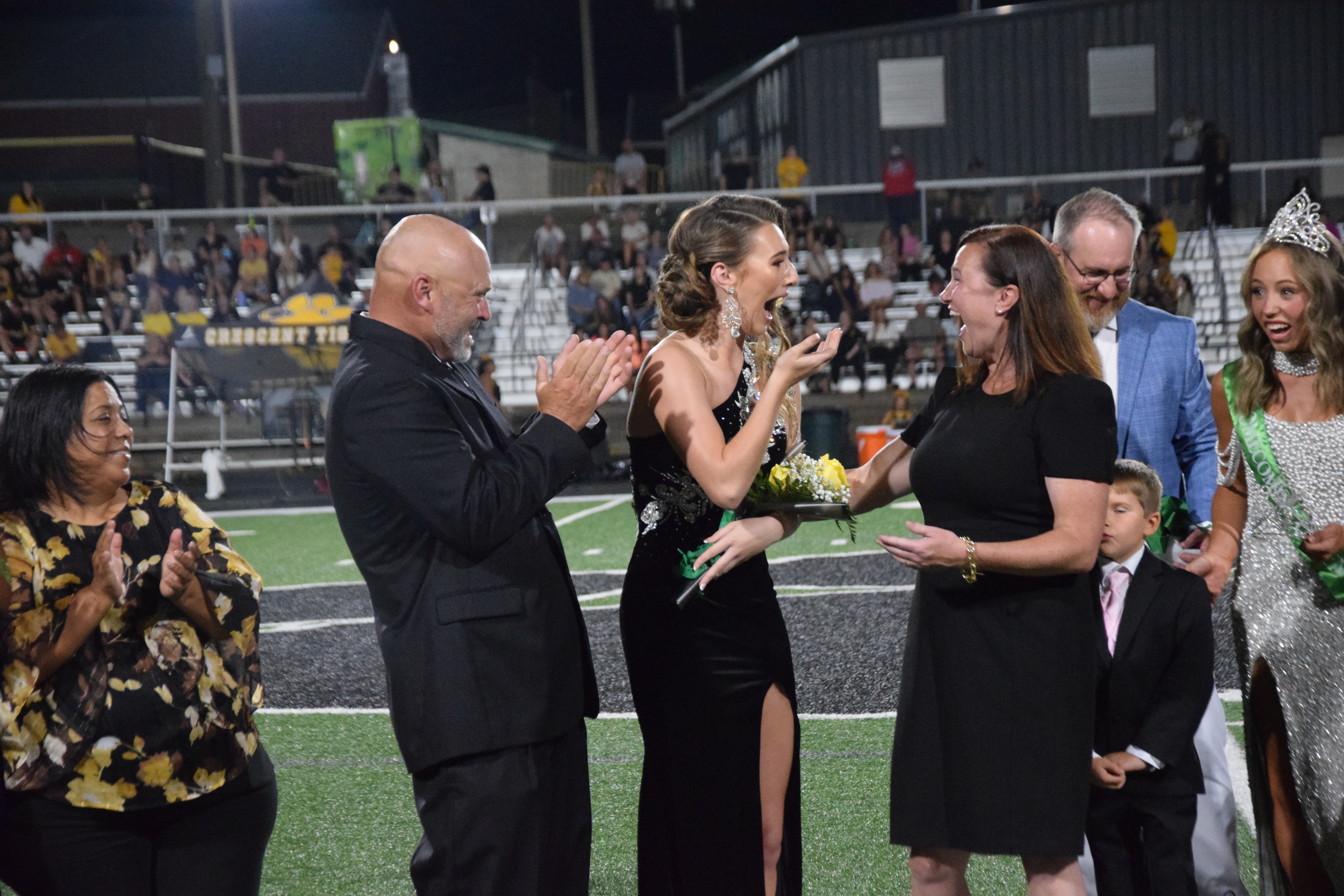 Franklin County High School senior Mia Patterson (above photo, center) reacts Friday after it was announced that she is the 2026 Homecoming Queen for Franklin County High School. 