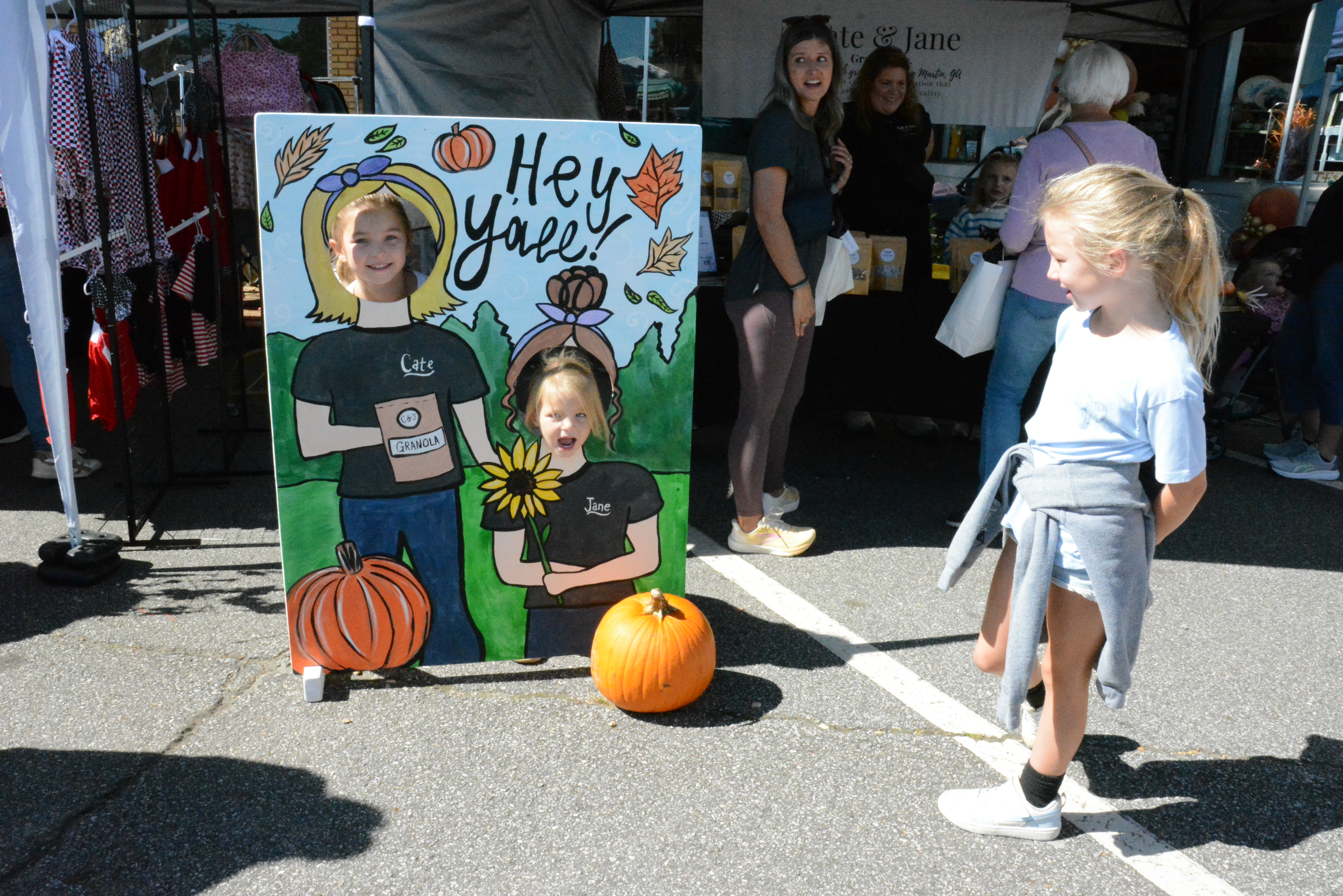 Sisters Brylee, Maggie and Kamdyn Thornton took turns having a “Hey Y’all” photo op at Saturday’s Fall in Love With Lavonia Fall Festival.