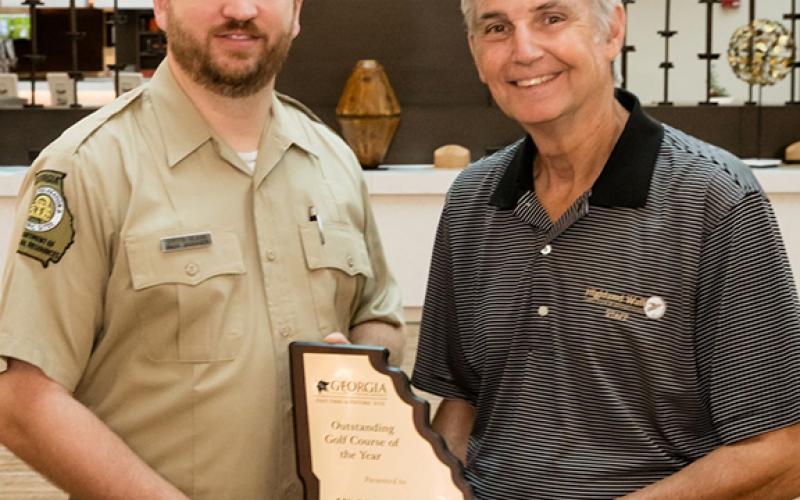 Pictured is Curtis Glass (left) of the DNR and Bill Schuster (right) of Highland Walk.