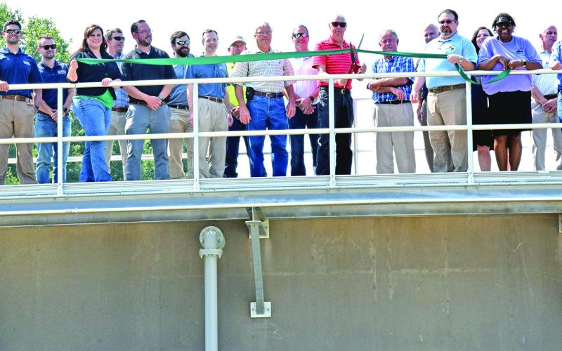 Franklin County and Carnesville city officials were joined by engineers and contractors in a ribbon-cutting ceremony (above) Tuesday at the county’s new wastewater treatment plant in Carnesville. A tour of the plant was held after the ribbon cutting. (Photo by Scoggins)