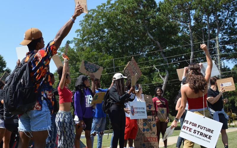 Students and members of the community took part in a Fridays for Future environmental rally Friday at Emmanuel College to bring attention to efforts to clean up the environment and combat climate change. (Photo courtesy of Trinity Duarte)