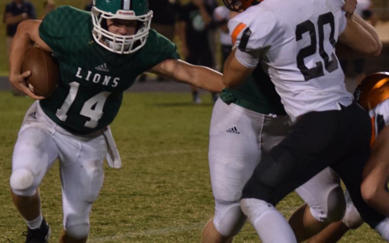 Franklin County quarterback Everett Haselden runs the ball during a game against Habersham Central Sept. 27 in Carnesville.