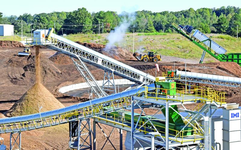 A large pile of wood will be burned to create electricity at the GRP Franklin plant, county officials learned on a tour Monday. Water runoff from the wood pile was the source of recent pollution in Indian Creek.