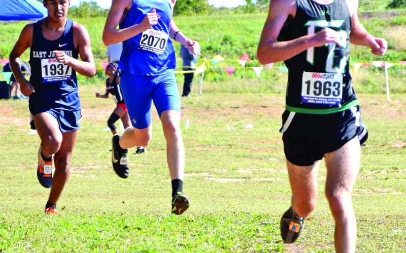 Lion Keaton Burton (right) took fourth-place overall to lead the Franklin County boys’ cross country team to the state meet for the first time in at least 12 years. (Photos by Scoggins)