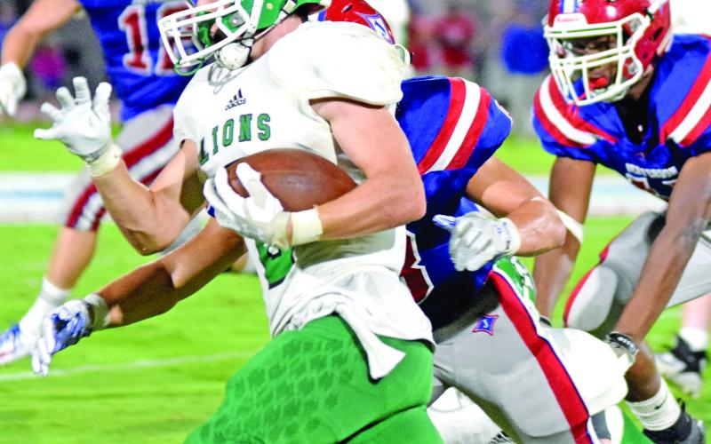 Sophomore Chris Goode turns upfield to gain part of his 84 yards against Jefferson Friday night. (Photo by Scoggins)