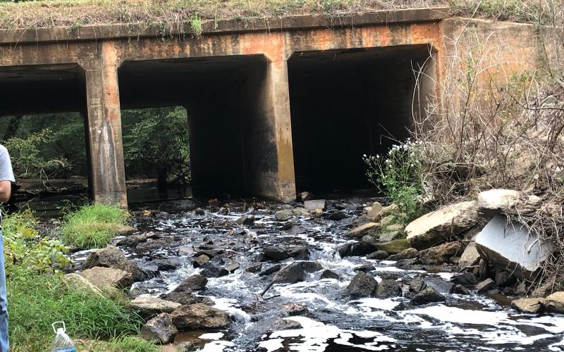 Residents along Indian Creek sent in photos of water in the stream running black Saturday due to what was found to be runoff from efforts at the GRP energy plant on Highway 198 to keep fires down in the plant’s wood pile that is being kept for fuel.