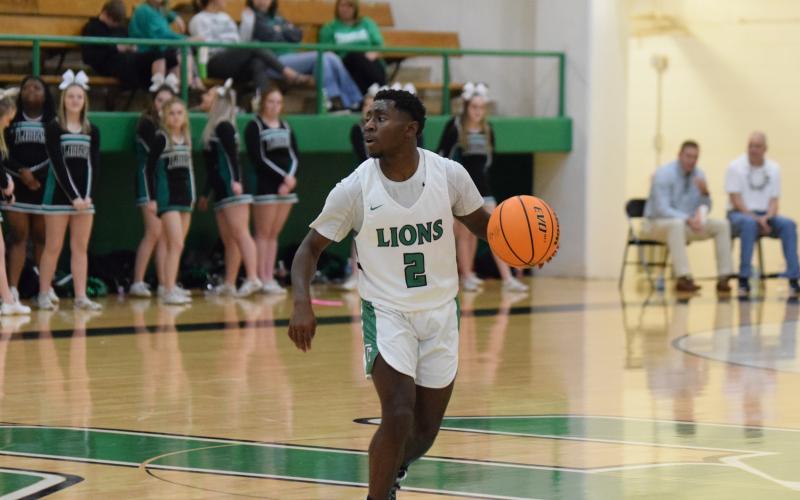 Lion Qua Jones looks for a play against Oglethorpe County Saturday in the Lions Den.