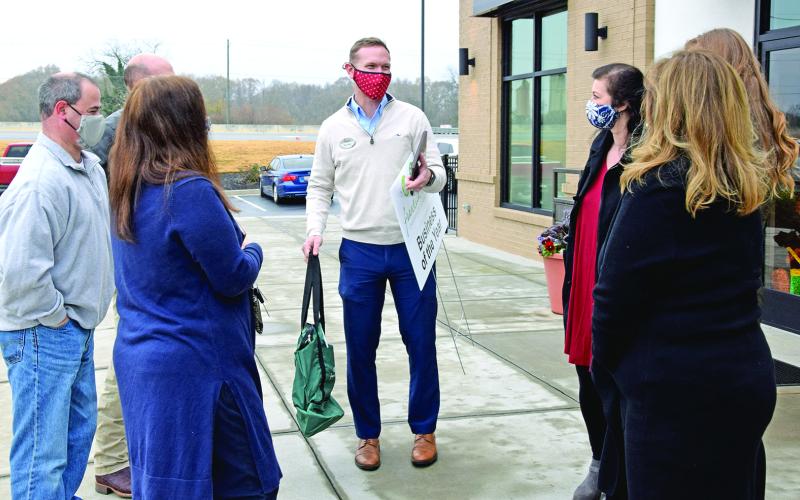 Dr. Clay Hearn (left in right photo) was named the Franklin County Chamber of Commerce’s Citizen of the Year last week, and Chick-Fil-A in Lavonia (above) was named Business of the Year. Chamber officers surprised Hearn and Chick-Fil-A Operator Will Lowe (above, center) with the awards. The chamber’s regular banquet where the awards are traditionally presented had to be cancelled this year due to the coronavirus pandemic.