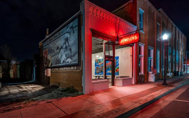 The former McCall Jewelers building in downtown Royston is now known as “The Gem,” an outdoor dining area for The Old Corner Hardware Store. Owner Kelley Tamplin refurbished the building to include picnic tables for those wishing to eat outside and commissioned a mural by her son Reed as part of an effort to make Royston a destination place for young people and couples. For complete details, see our Business Honor Roll on Pages 5-8A. (Photo courtesy of Kelley Tamplin)